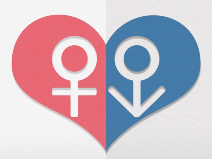 ハートマークの中に描かれた男性と女性の記号